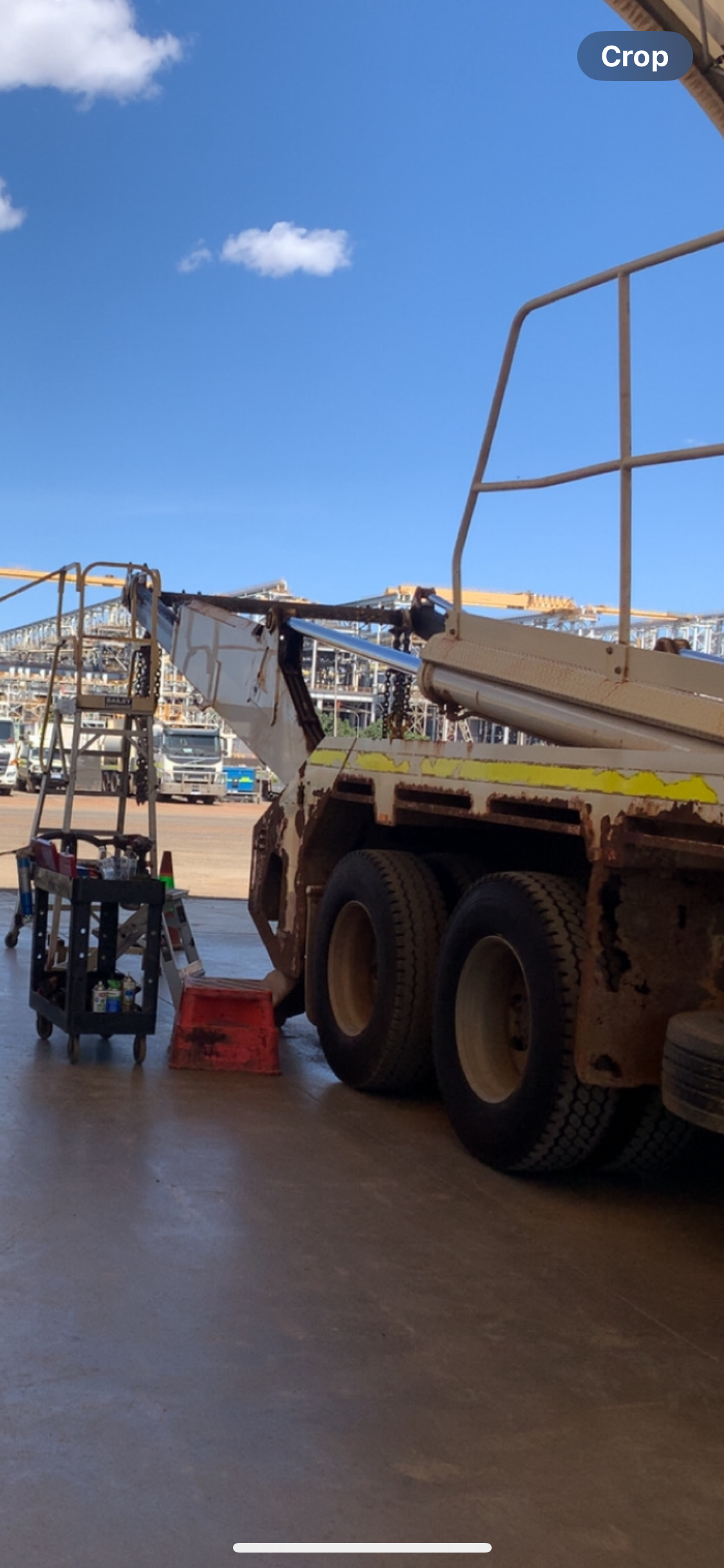 A flatbed truck parked outside on a sunny day. Equipment and a red bin are in view. — Bodes All Mechanical In Candelo, NSW