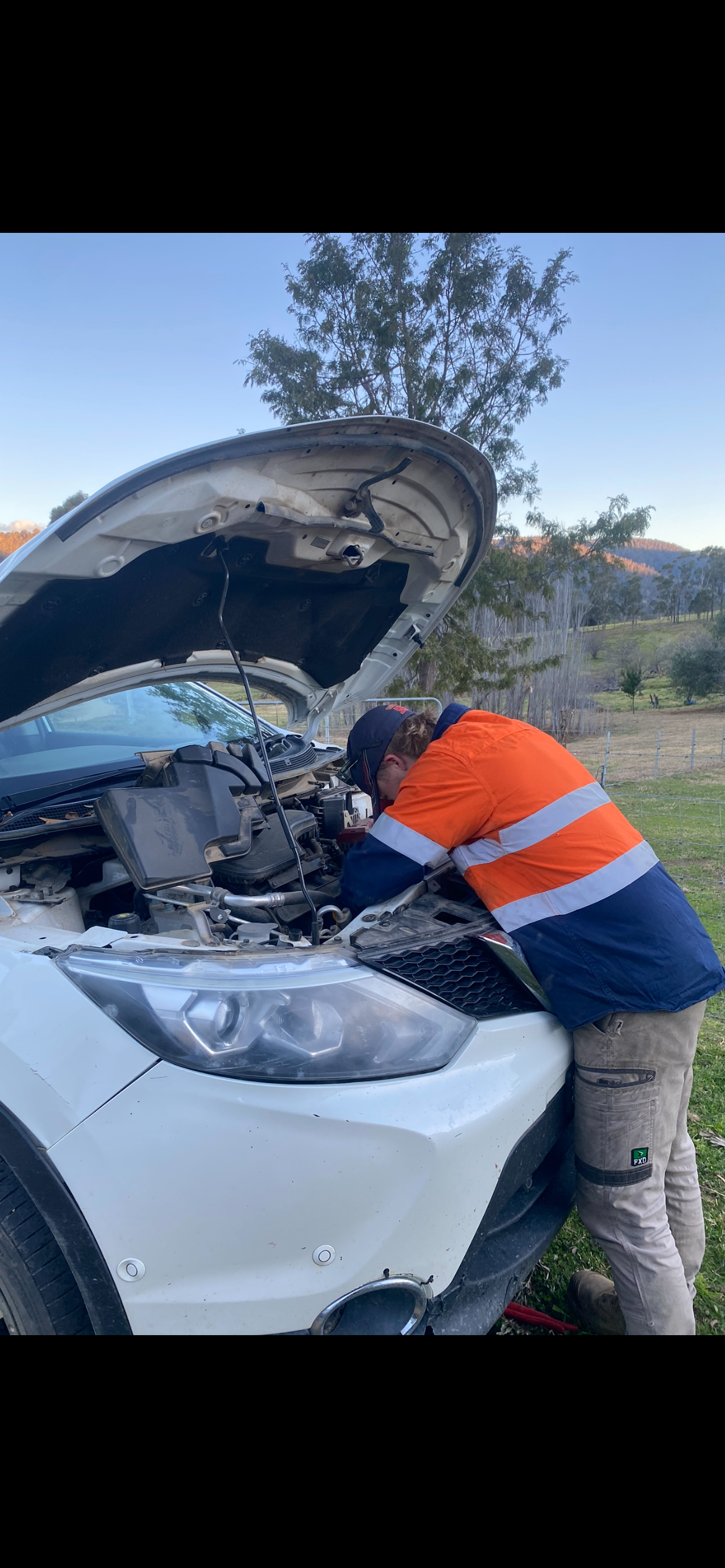 Person Working on a White Car With the Hood Open — Bodes All Mechanical In Tantawangalo, NSW