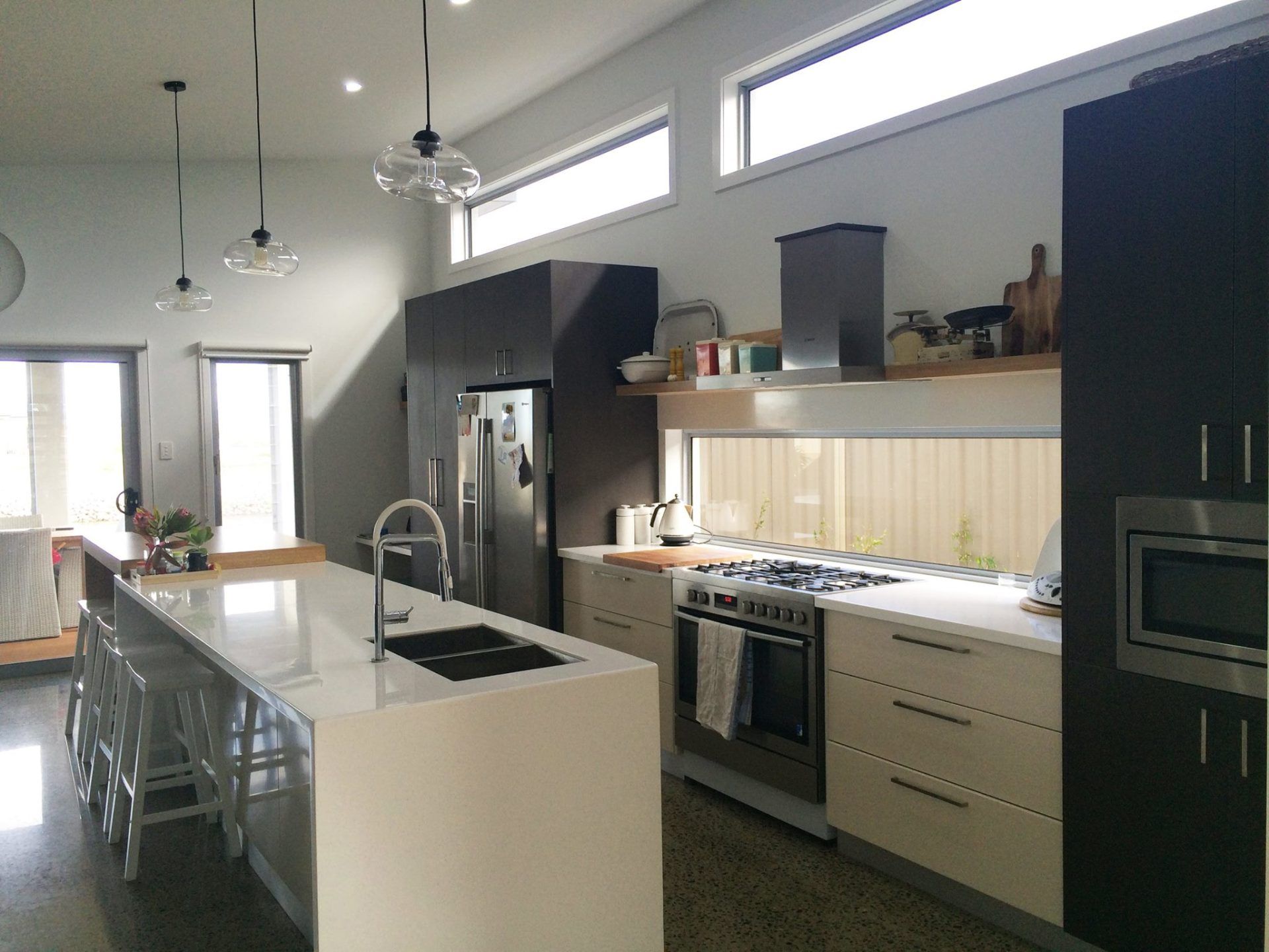 View of kitchen cabinets with counter tops