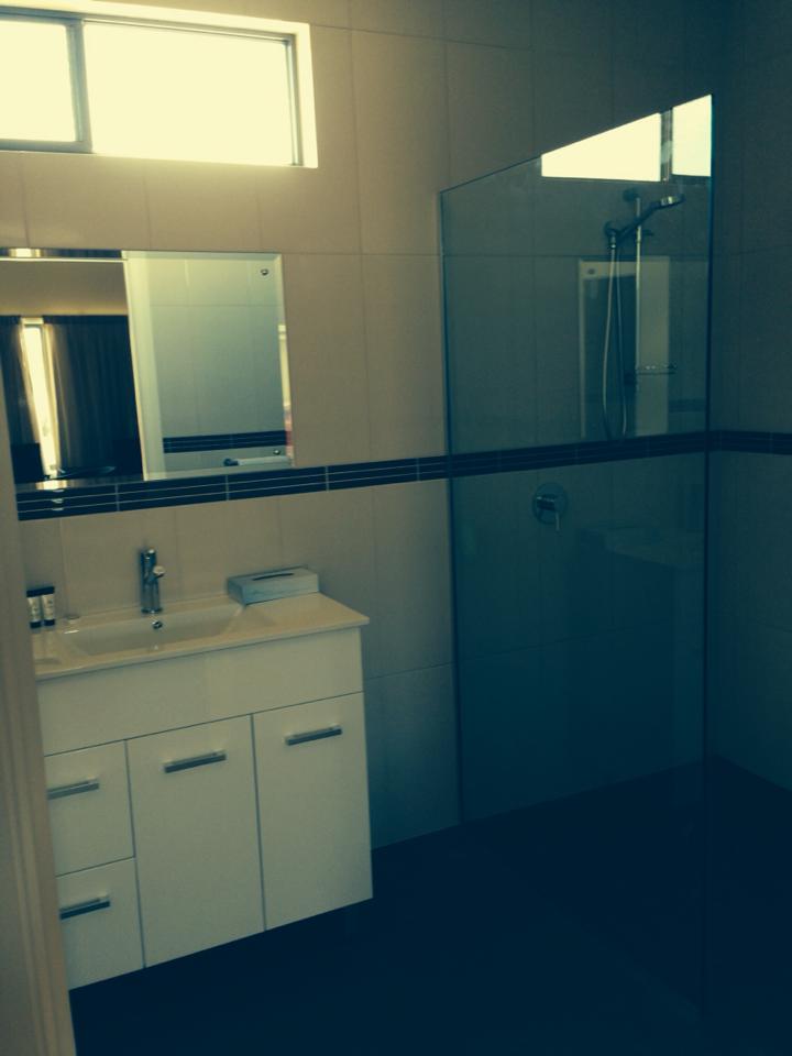 View of kitchen cabinets with counter tops