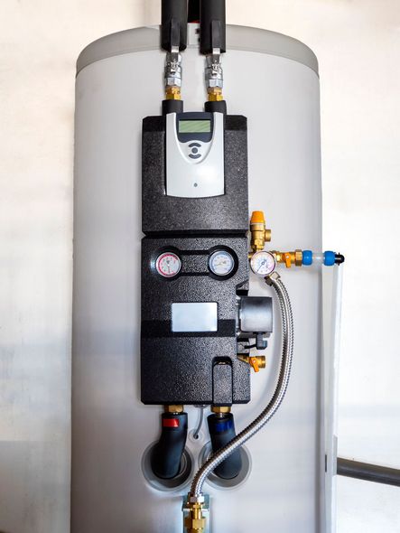 Water Heating Boiler With Pump — Sanford, MI — Carey Plumbing & Heating Inc