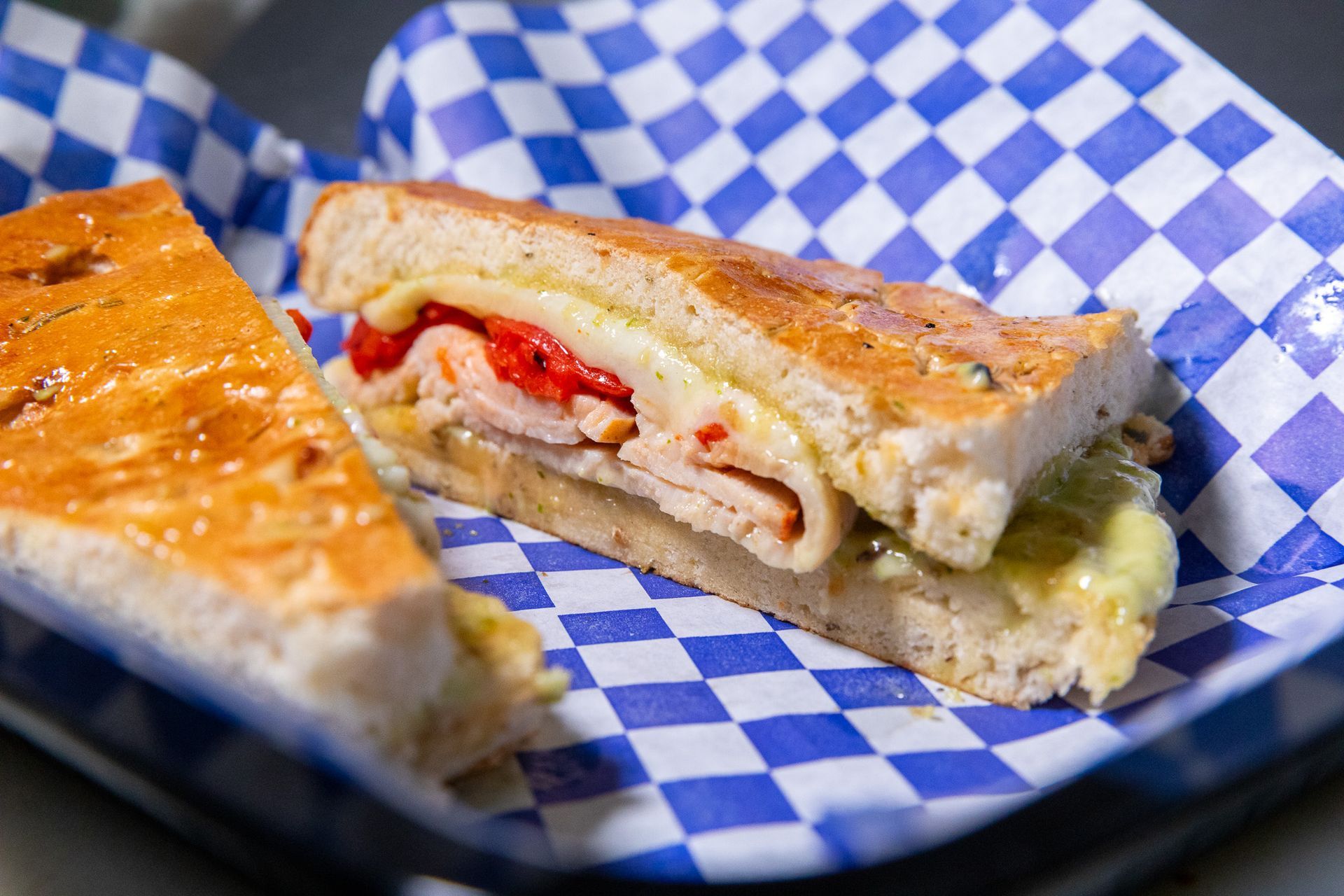 Chilaquiles with eggs, black beans, and toppings on a decorated plate.