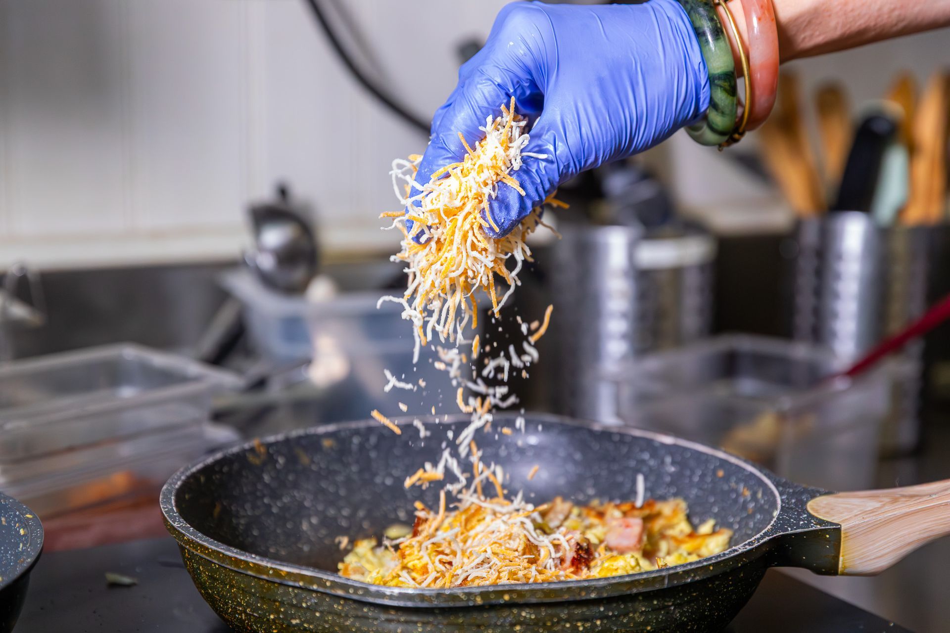 Breakfast plate with fried eggs, toast, sausage, and potatoes.