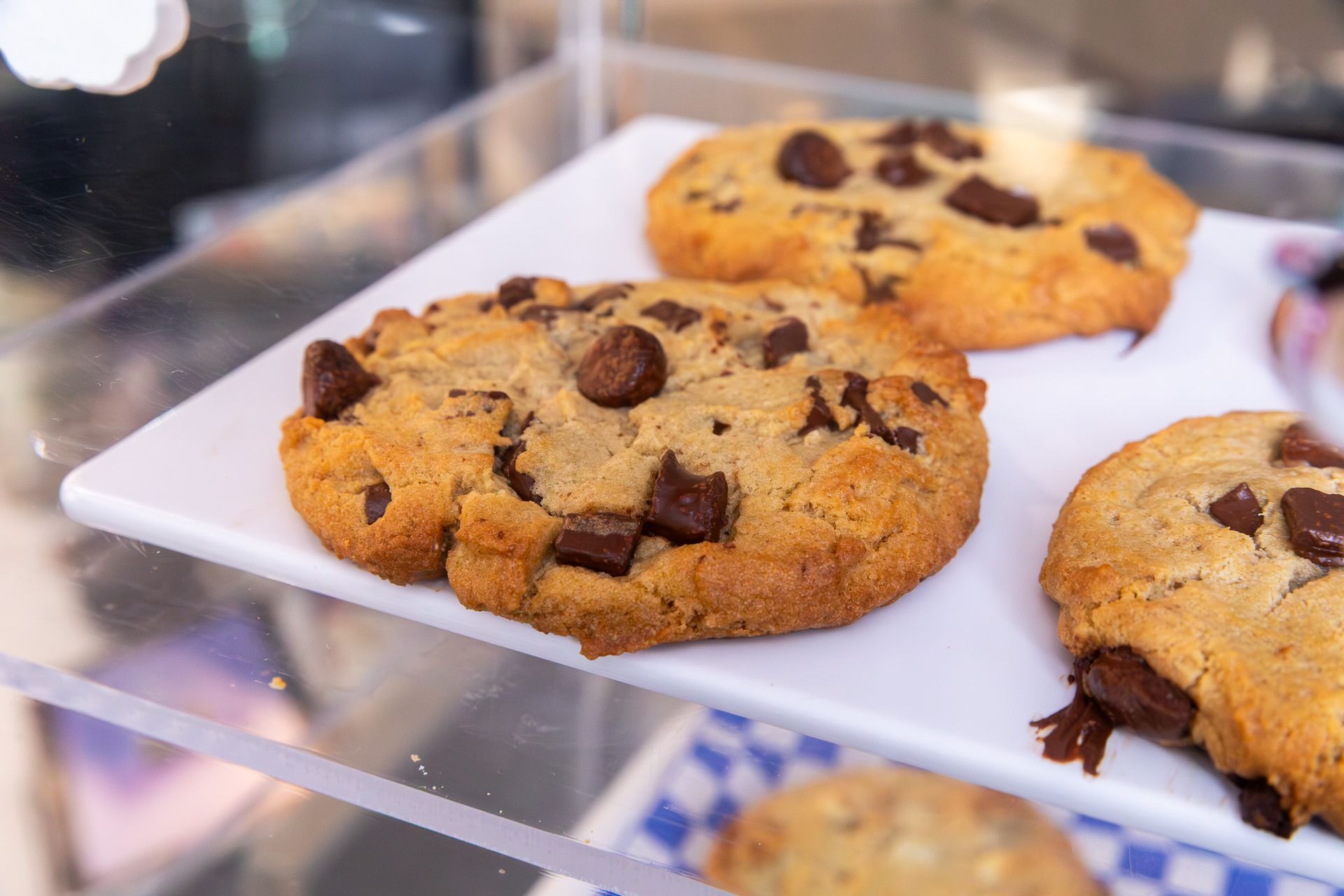 Breakfast plate with fried eggs, toast, sausage, and potatoes.