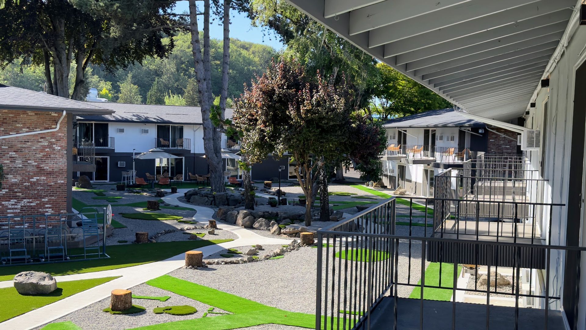 A view of a residential area from a balcony of a building.