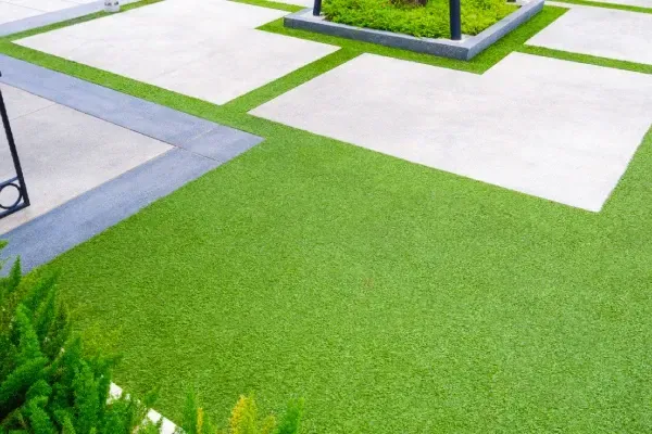 Synthetic grass installation creating low-maintenance and durable outdoor spaces