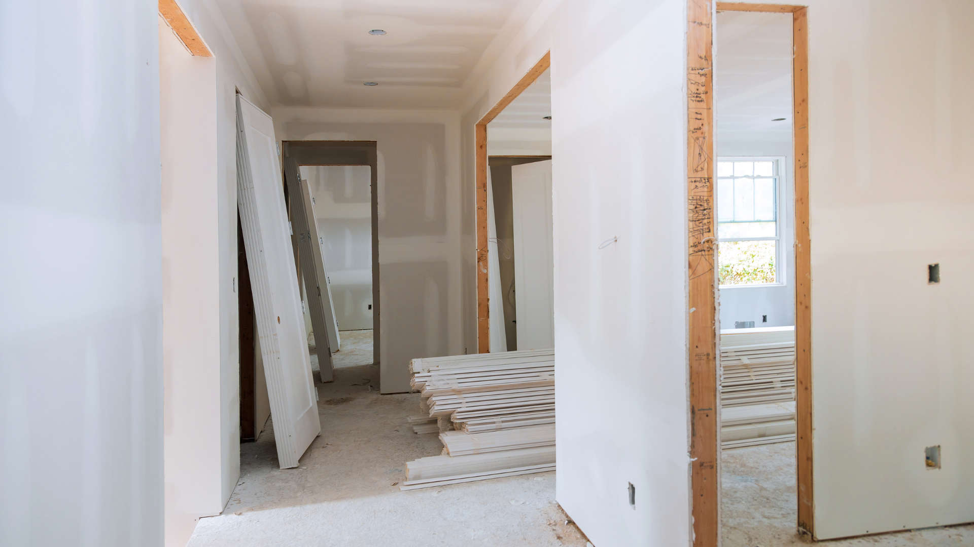 A hallway in a house that is being remodeled.