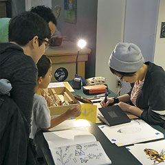 GNSI Northwest Chapter’s Burke Museum Bug Blast event. Students working at a table.