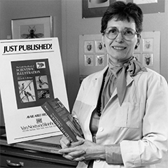 Elaine poses for a publicity photo in her office after the release of the first edition on the Guild Handbook of Scientific Illustration, 1989. ©Smithsonian Institution