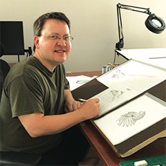 Rick Simonson in his studio working on a new drawing.