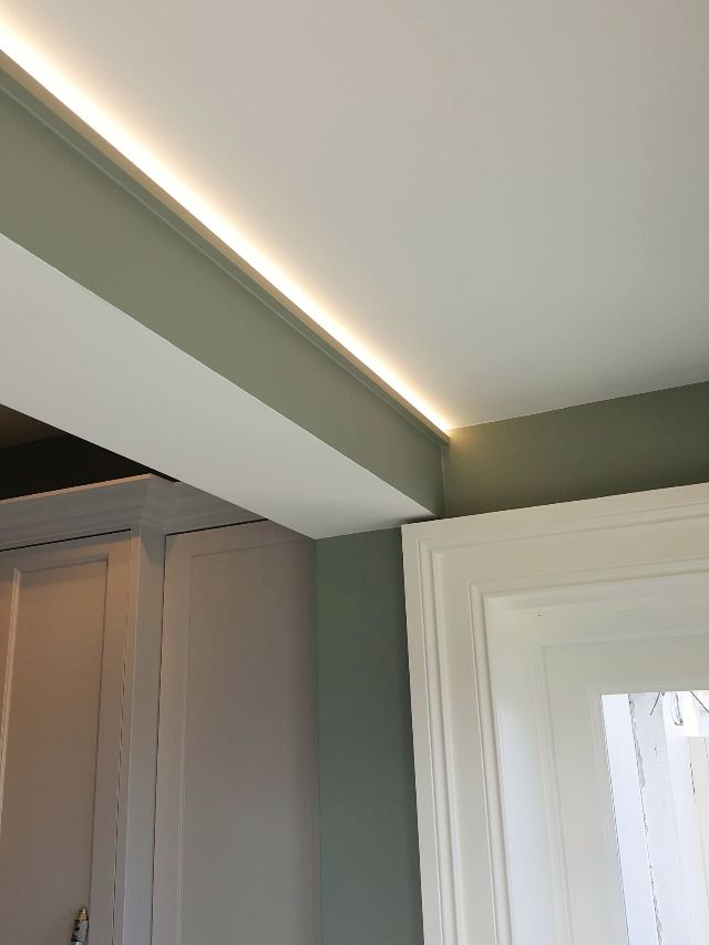 A room with a ceiling that has a light on it