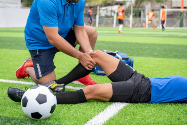 Picture of a sports related injury on a soccer field.