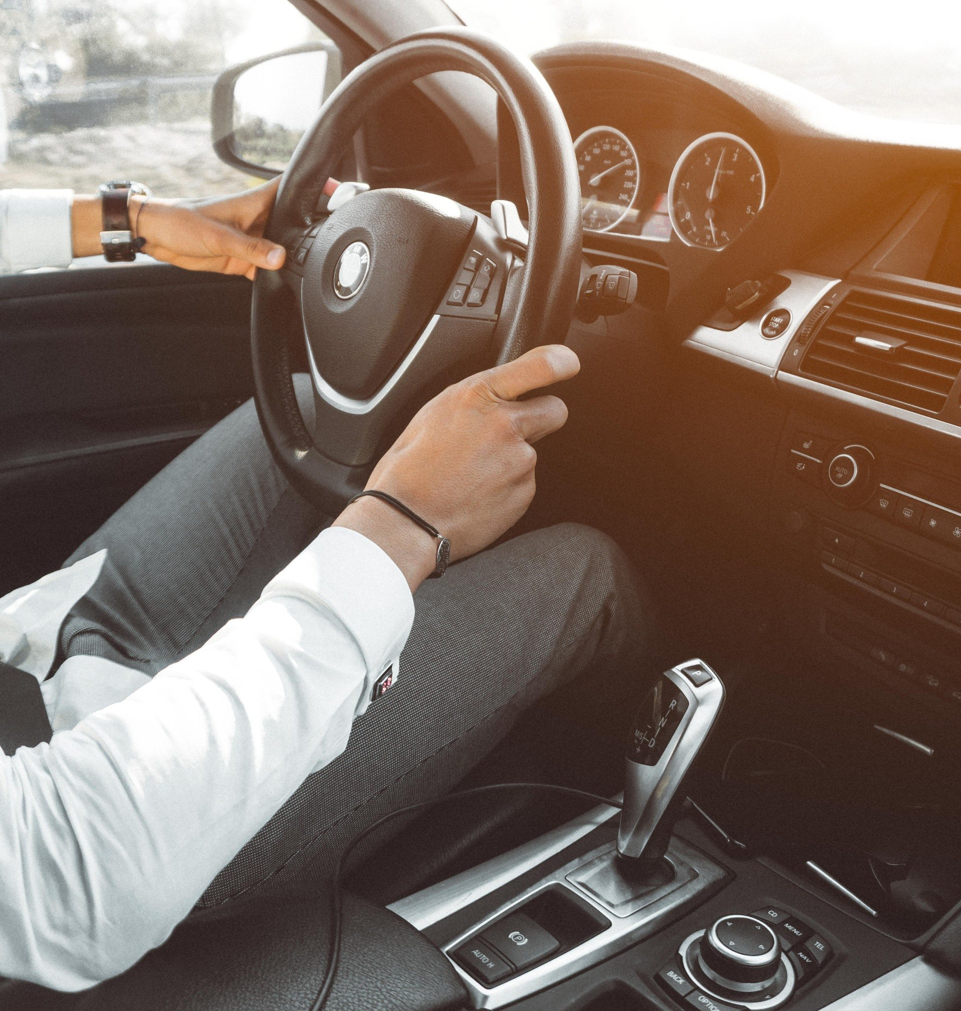 Picture of a person driving a car.