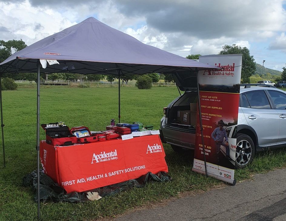 White Tent With Products On The Table  —  Accidental Health & Safety NQ & Mt Isa In Charters Towers, QLD