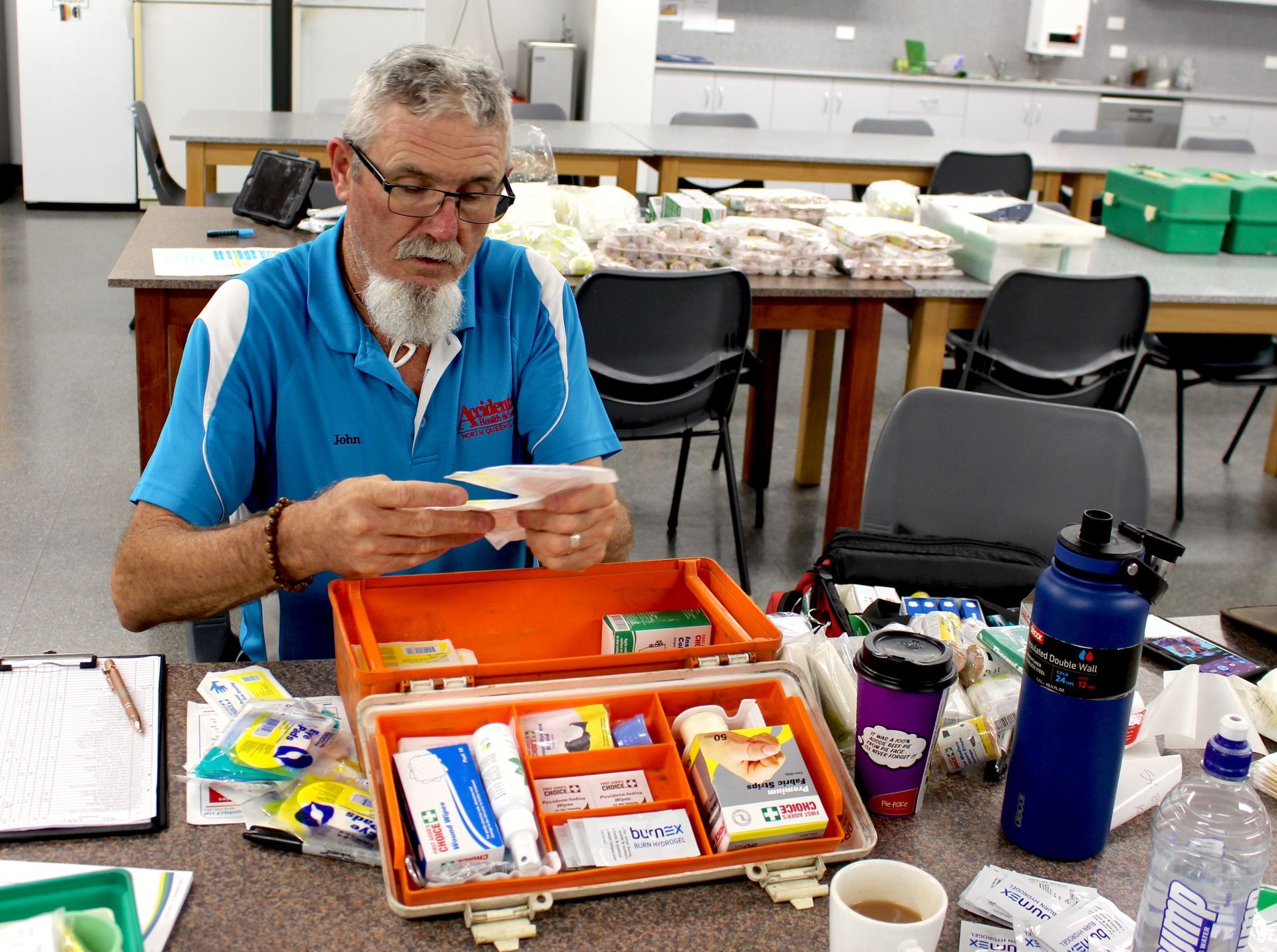Accidental Health And Safety Owner Beside The Products — Accidental Health & Safety NQ & Mt Isa In Garbutt, QLD