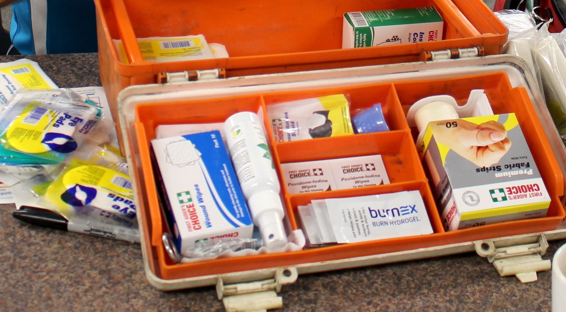A First Aid Kit Is Sitting On A Table  —  Accidental Health & Safety NQ & Mt Isa In Charters Towers, QLD