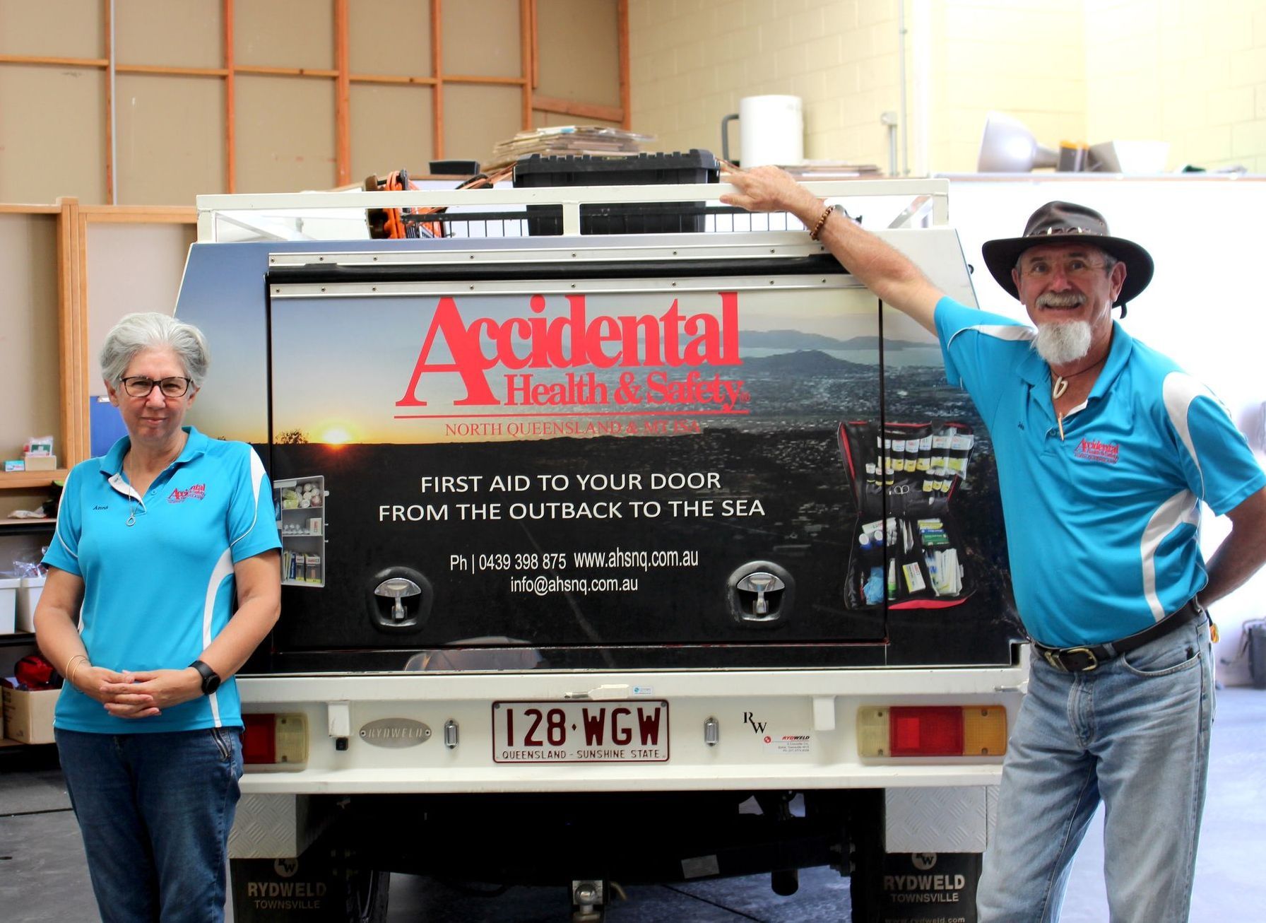 Owner Close Up Photo Beside The White Vehicle Service - Providing First Aid Supplies in Garbutt, QLD 