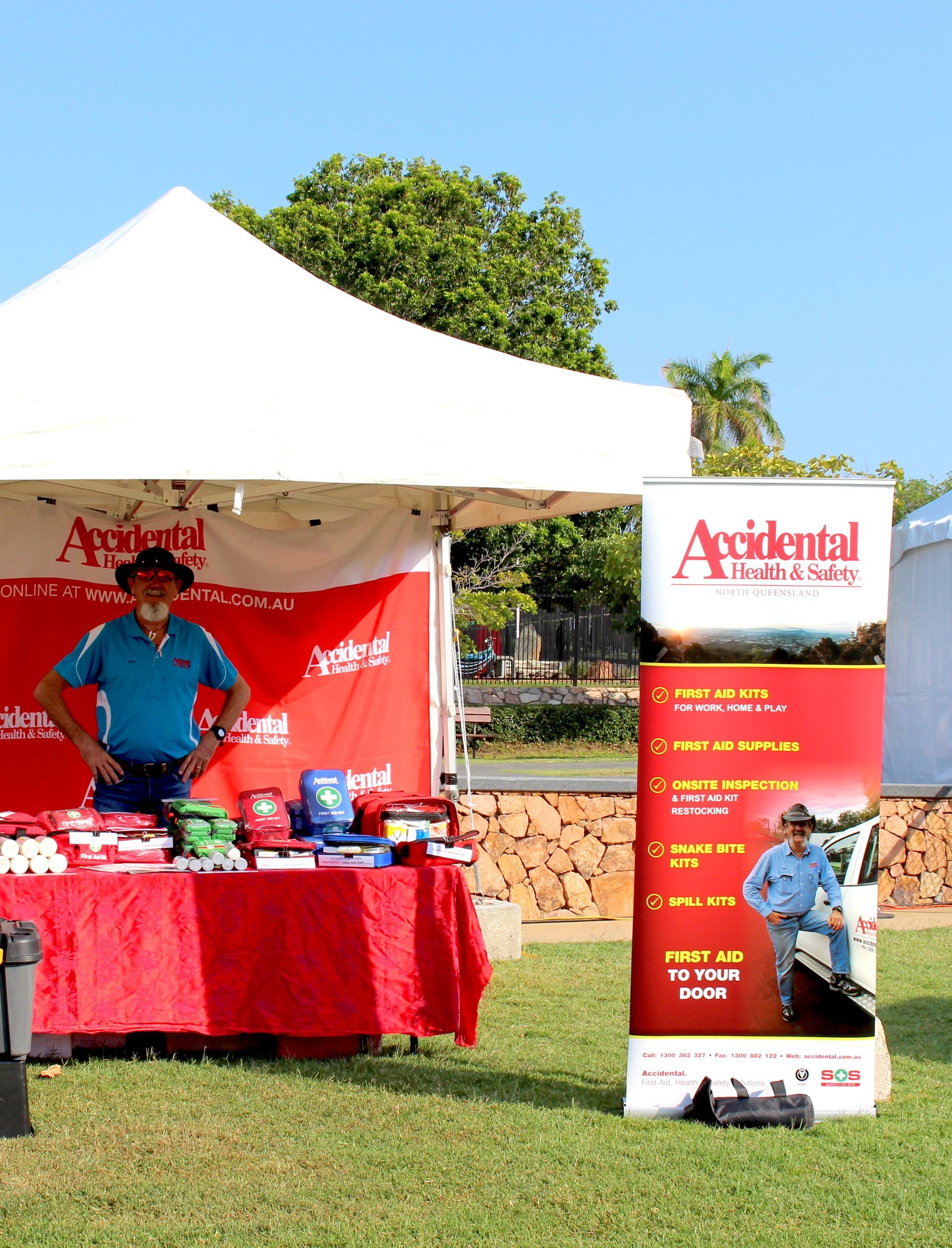 Man Standing By Display Tent — Accidental Health & Safety NQ & Mt Isa In Garbutt, QLD