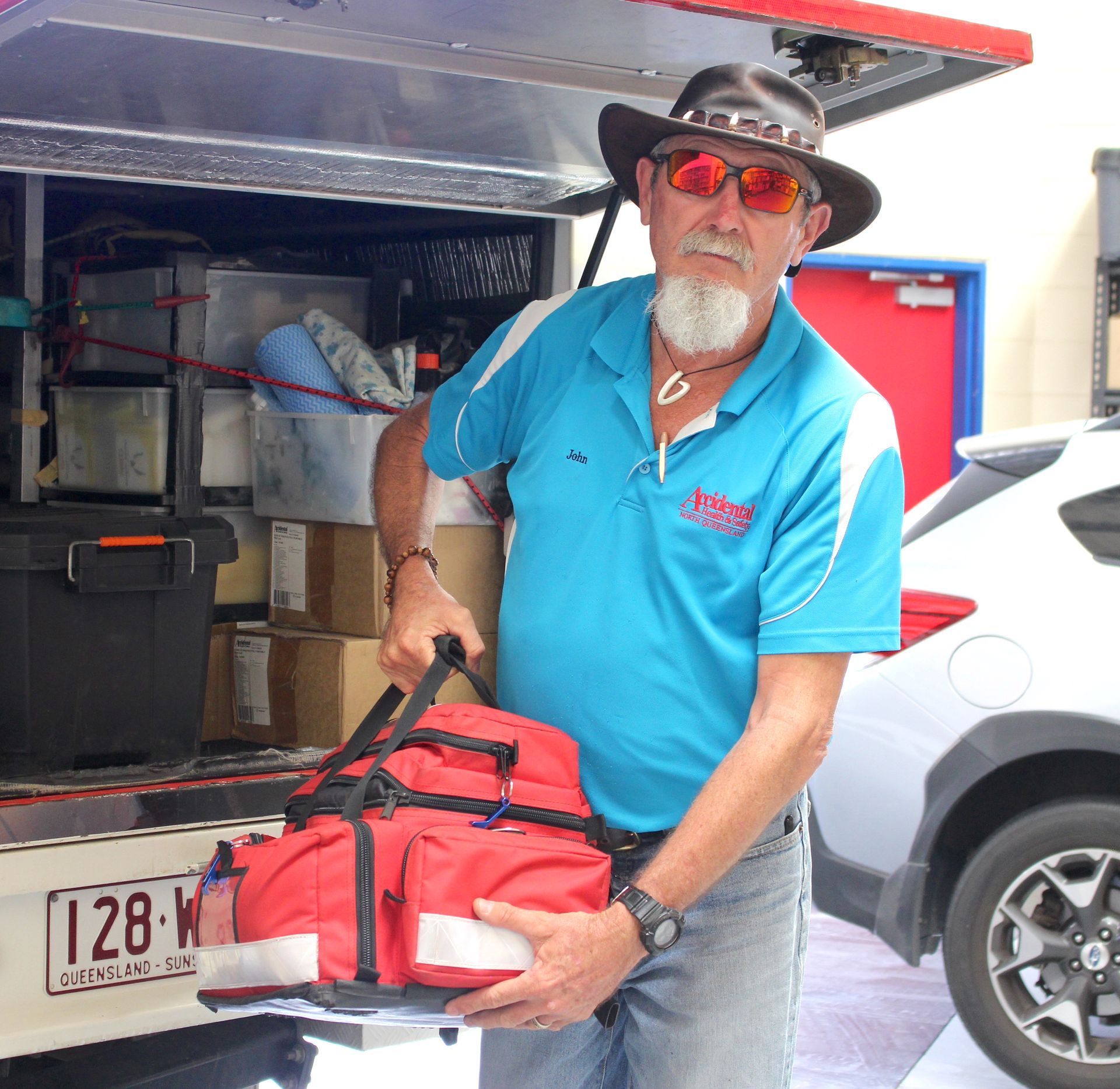 Man Delivering First Aid Kit—  Accidental Health & Safety NQ & Mt Isa In Charters Towers, QLD
