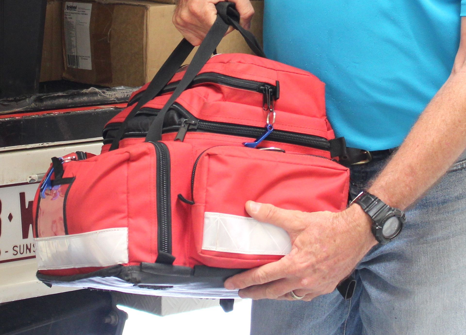 Man Carrying First Aid Kit  —  Accidental Health & Safety NQ & Mt Isa In Ingham, QLD