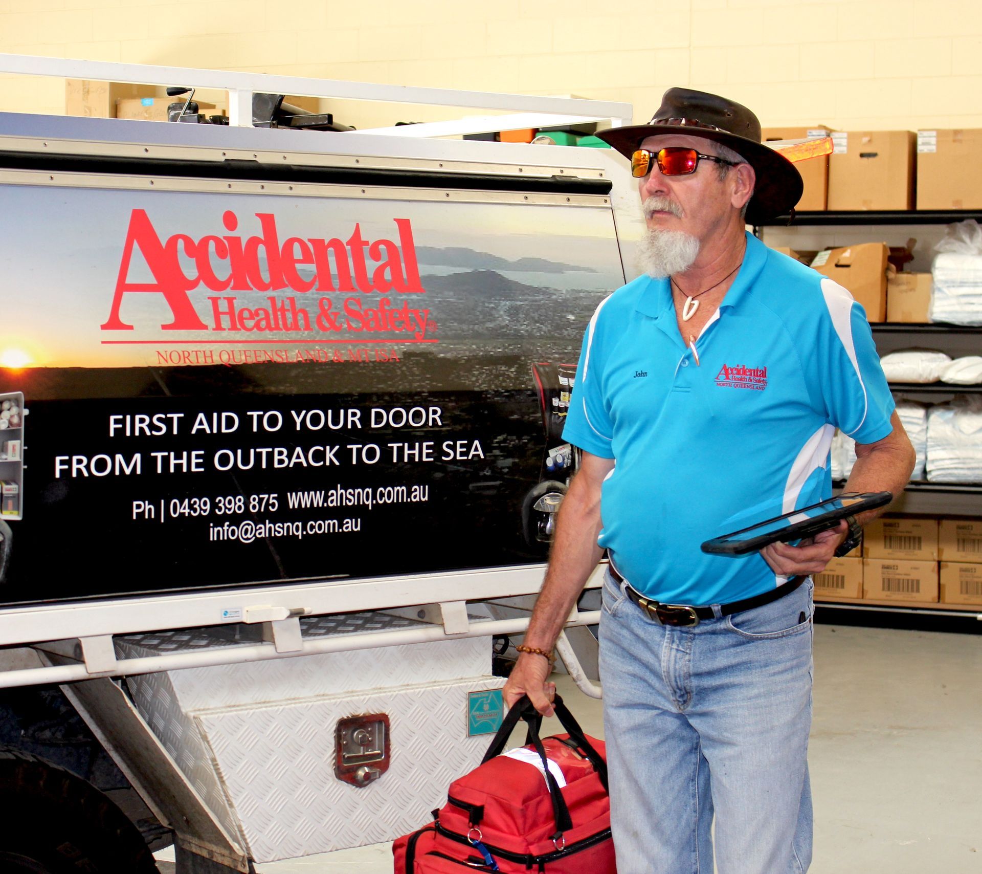 Man First Aid Kit In His Hand —Accidental Health & Safety NQ & Mt Isa In Ingham, QLD