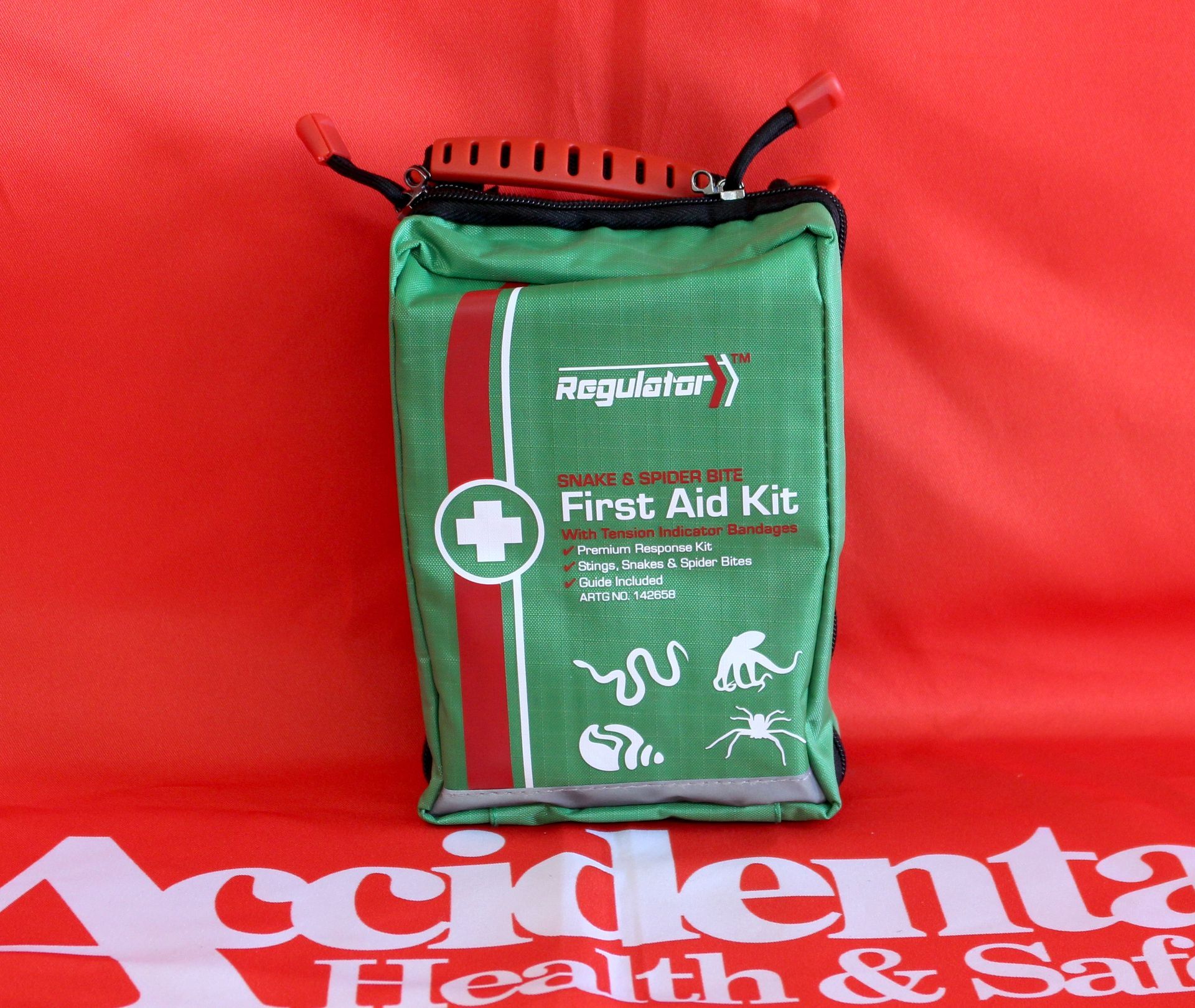 A Green First Aid Kit Is On A Red Background  —  Accidental Health & Safety NQ & Mt Isa In Mt Isa, QLD