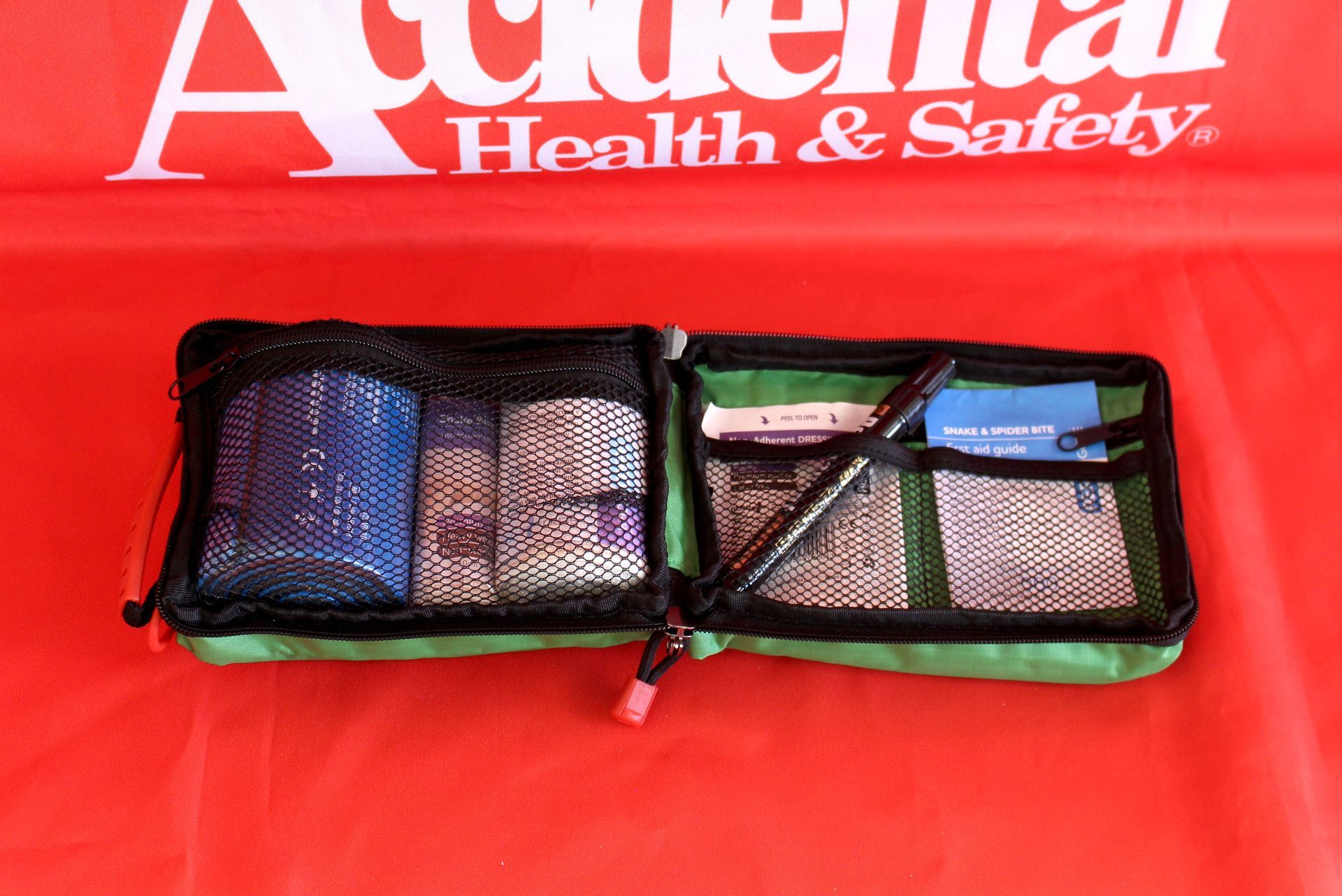 First Aid Kit On Red Background - Providing First Aid Supplies in Garbutt, QLD