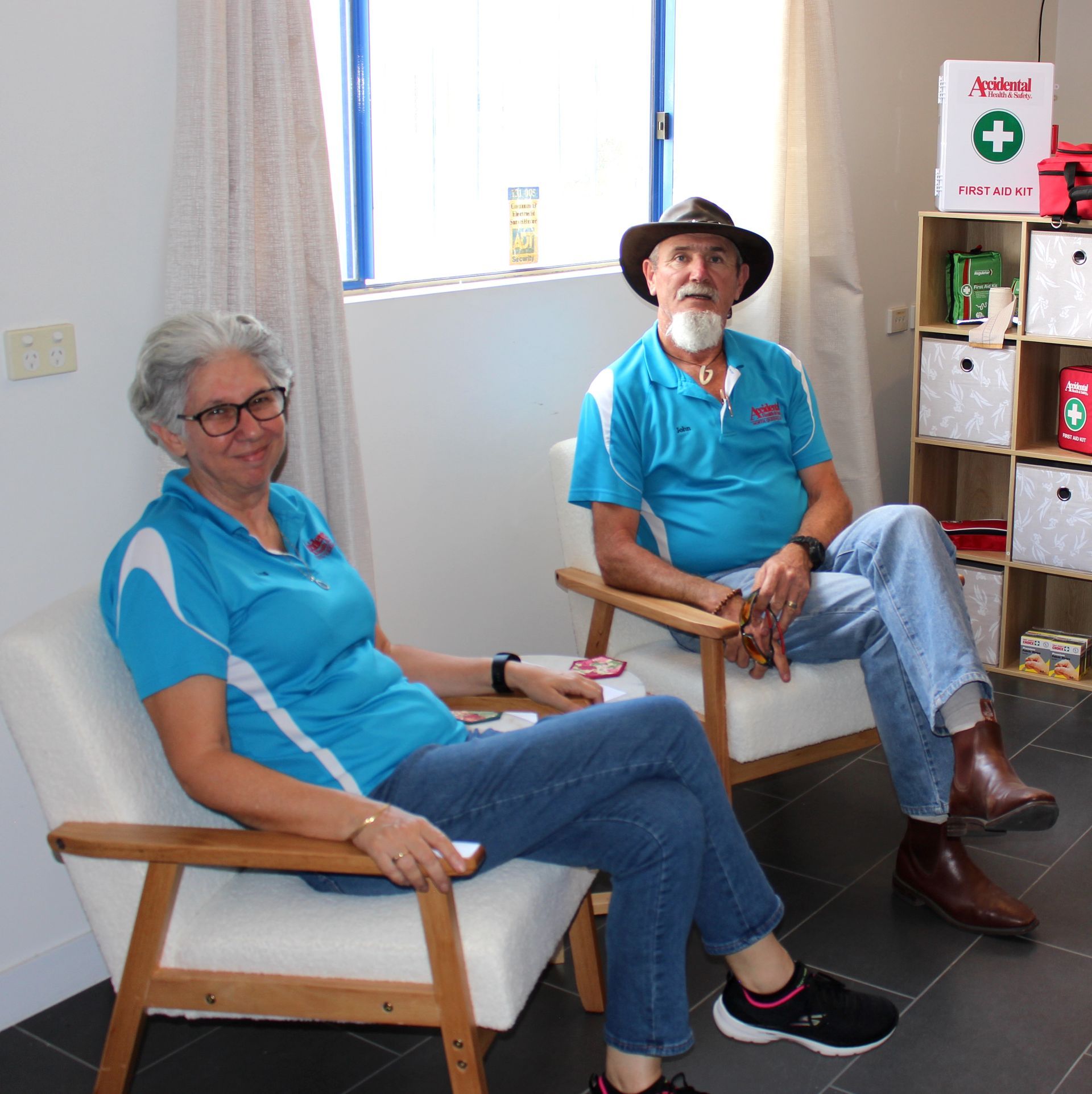 A Man And A Woman Sit In Chairs In Front Of A First Aid Kit —  Accidental Health & Safety NQ & Mt Isa In Garbutt, QLD