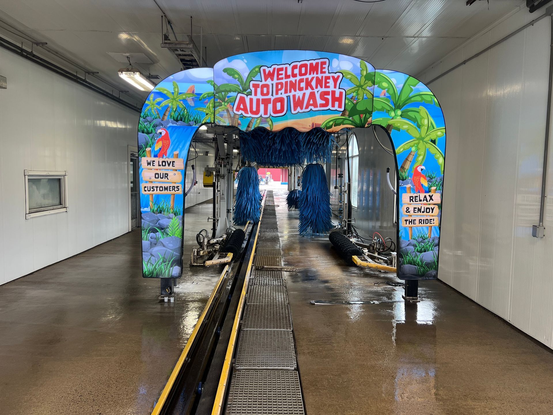 pinckney auto wash entrance arch welcome to a tropical car wash Logo of a wave full color version of carwash logo