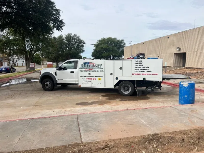 A white utility truck labeled 