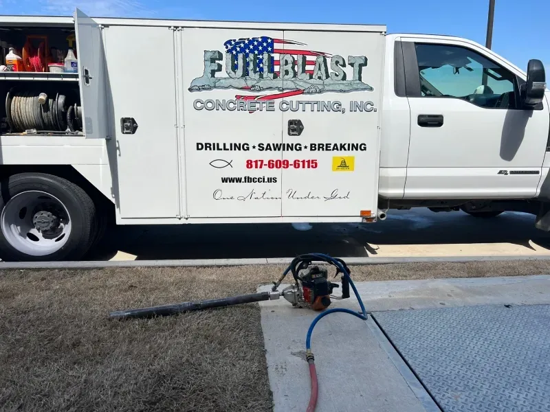 A white service truck labeled 