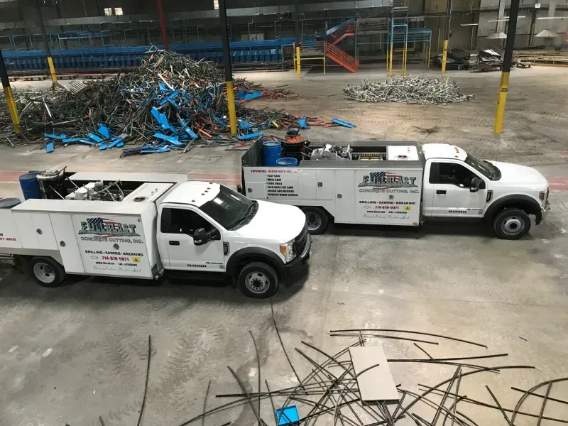 Two white service trucks marked 