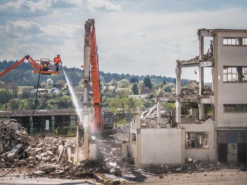 Watering Down Demolition Debris  — Walsh Demolition Pty Ltd in Grafton, NSW