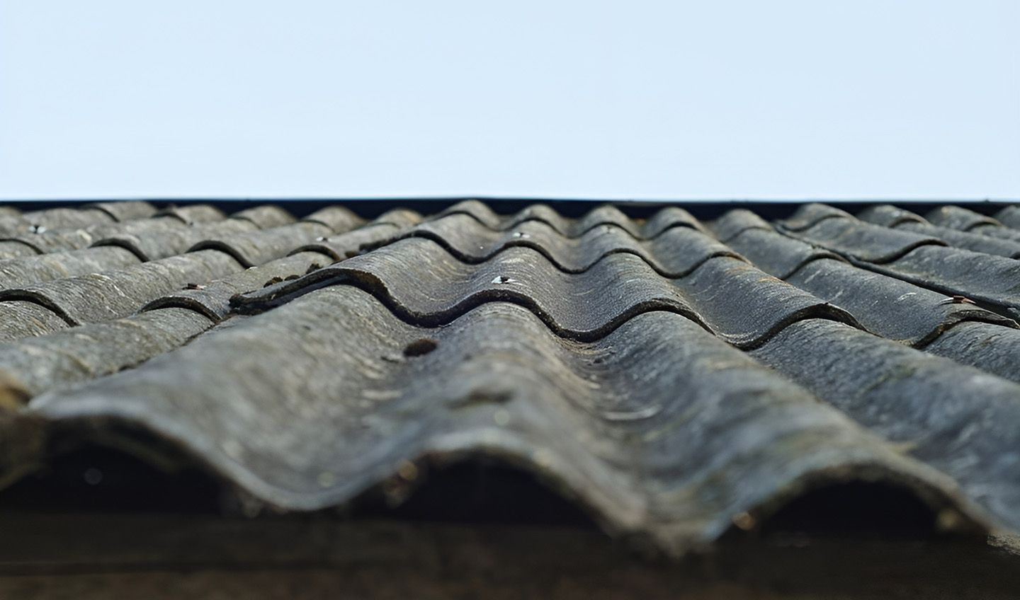 Weathered Fibro Roof Sheets Indicating Asbestos In Older Homes