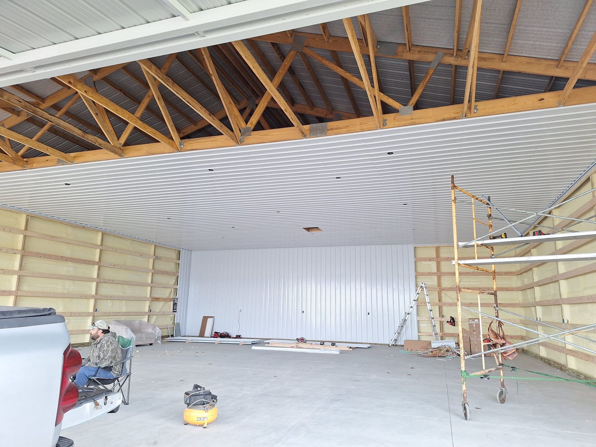 A large empty building with a ceiling that is being built.