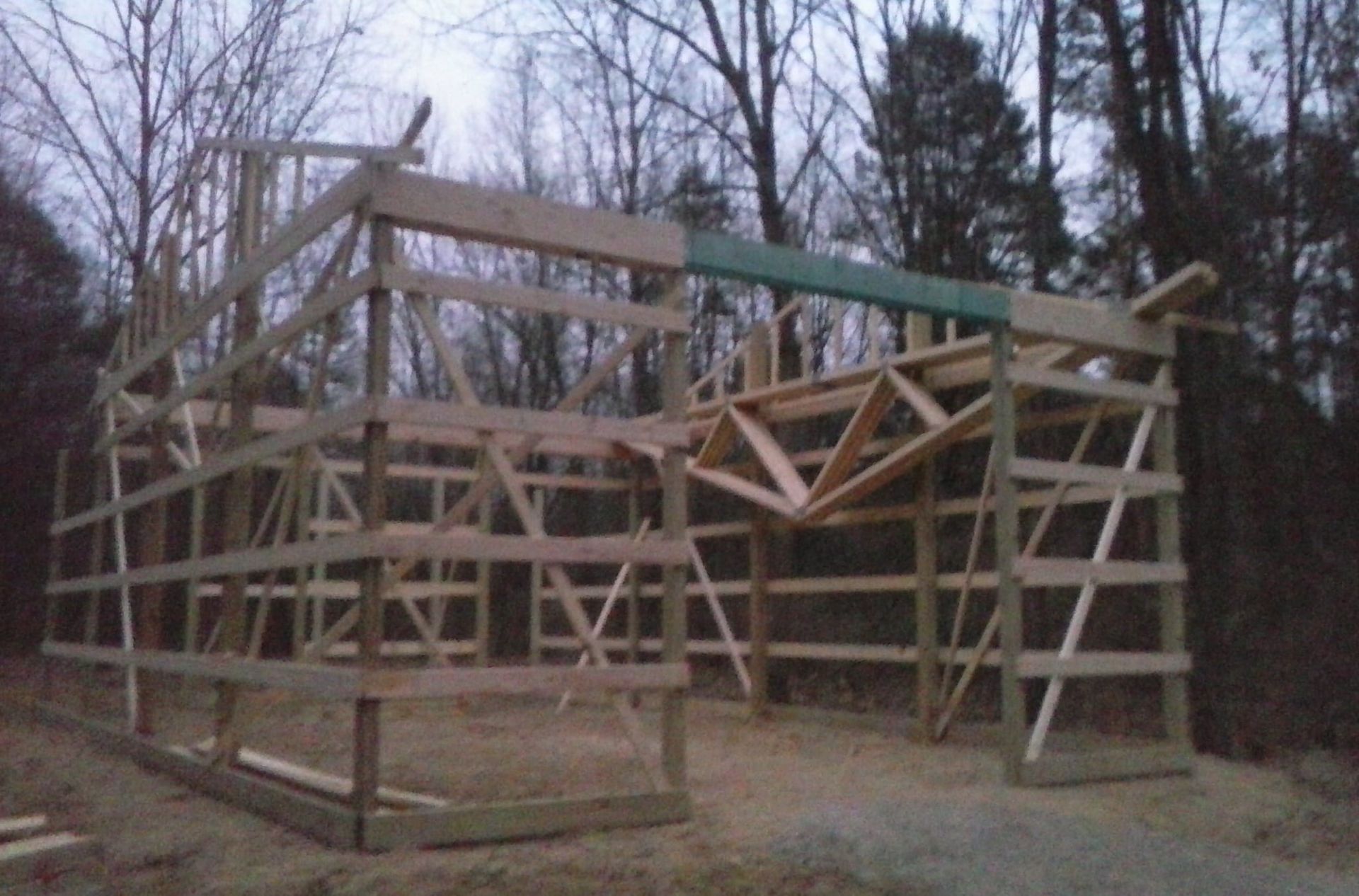 A wooden structure is being built in the woods