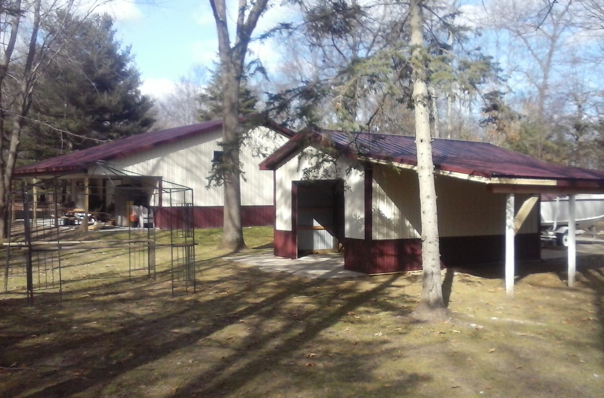 A house with a purple roof is surrounded by trees