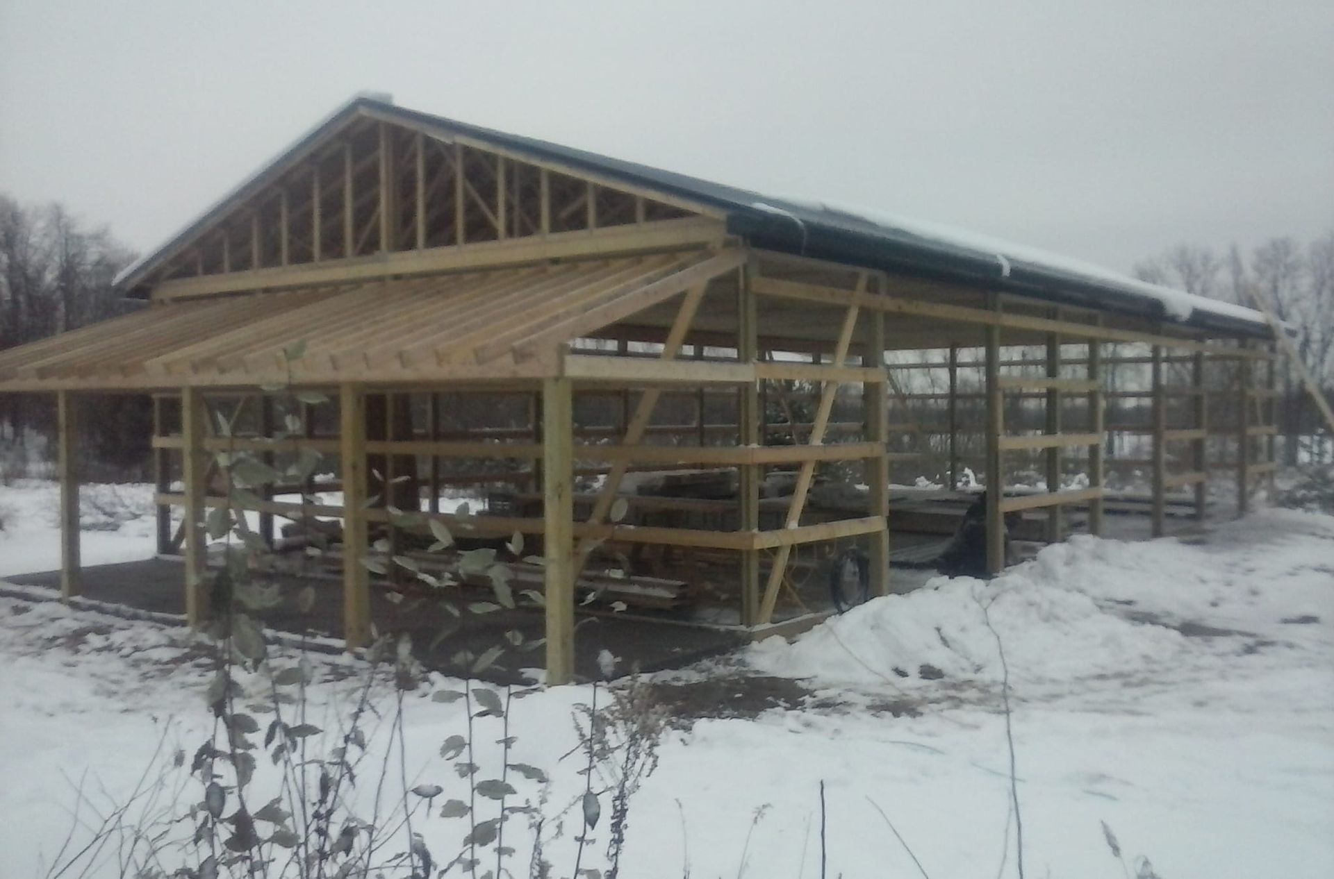 A wooden structure is being built in the snow