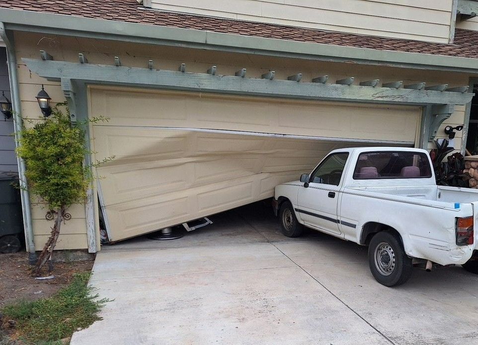 A large house with a large garage and a porch