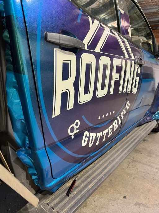 A Roofing And Guttering Truck Is Parked In A Garage — McKnight Signs In Armidale, NSW