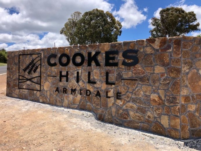A Stone Wall With A Sign That Says Cookes Hill Armidale — McKnight Signs In Hillvue, NSW