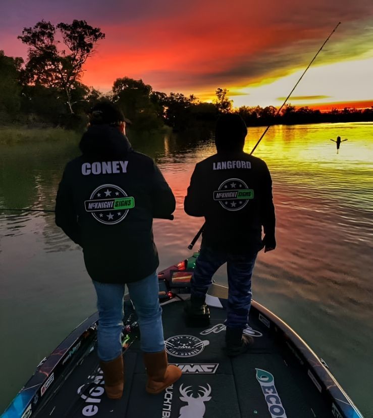 Two People In A Boat With One Wearing A Jacket That Says Coney — McKnight Signs In Hillvue, NSW