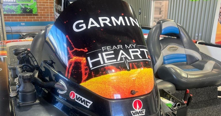 A Garmin Branded Outboard Motor Is Sitting On Top Of A Boat — McKnight Signs In Hillvue, NSW