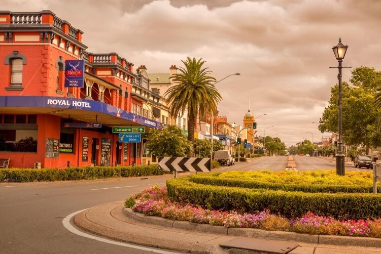 There Is A Roundabout In The Middle Of The Street In Front Of A Hotel — McKnight Signs In Muswellbrook, NSW