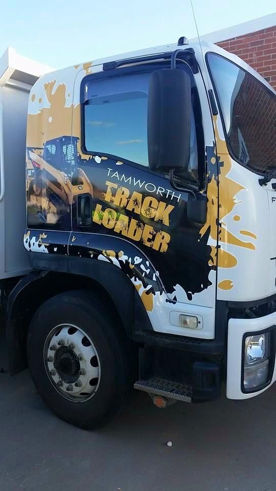 A White Truck With A Yellow And Black Graphic — McKnight Signs In Hillvue, NSW