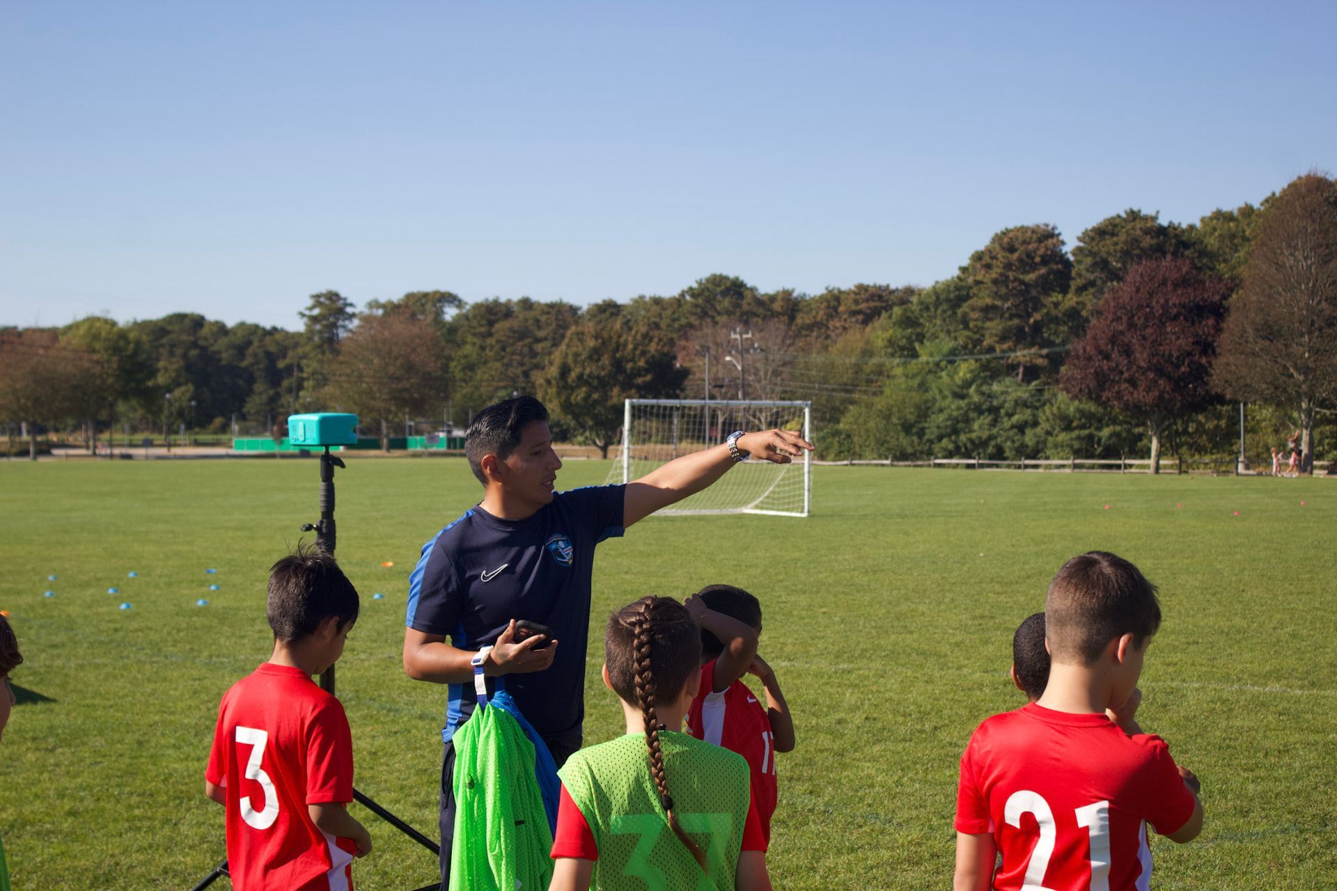 Coach Mario directing from the sidelines.