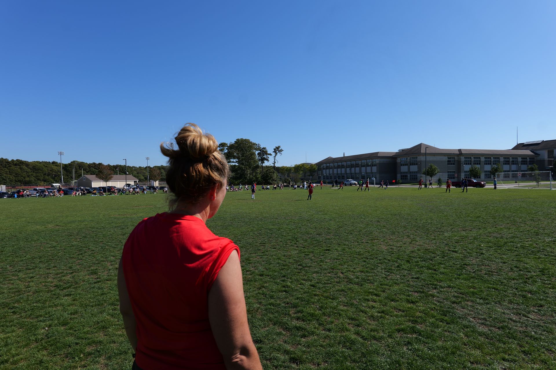 Girls Director and Coach Yvonna, overseeing ACI girls soccer team games.