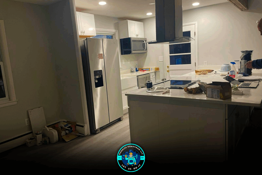 Kitchen with white cabinets, stainless steel appliances, and a central island.