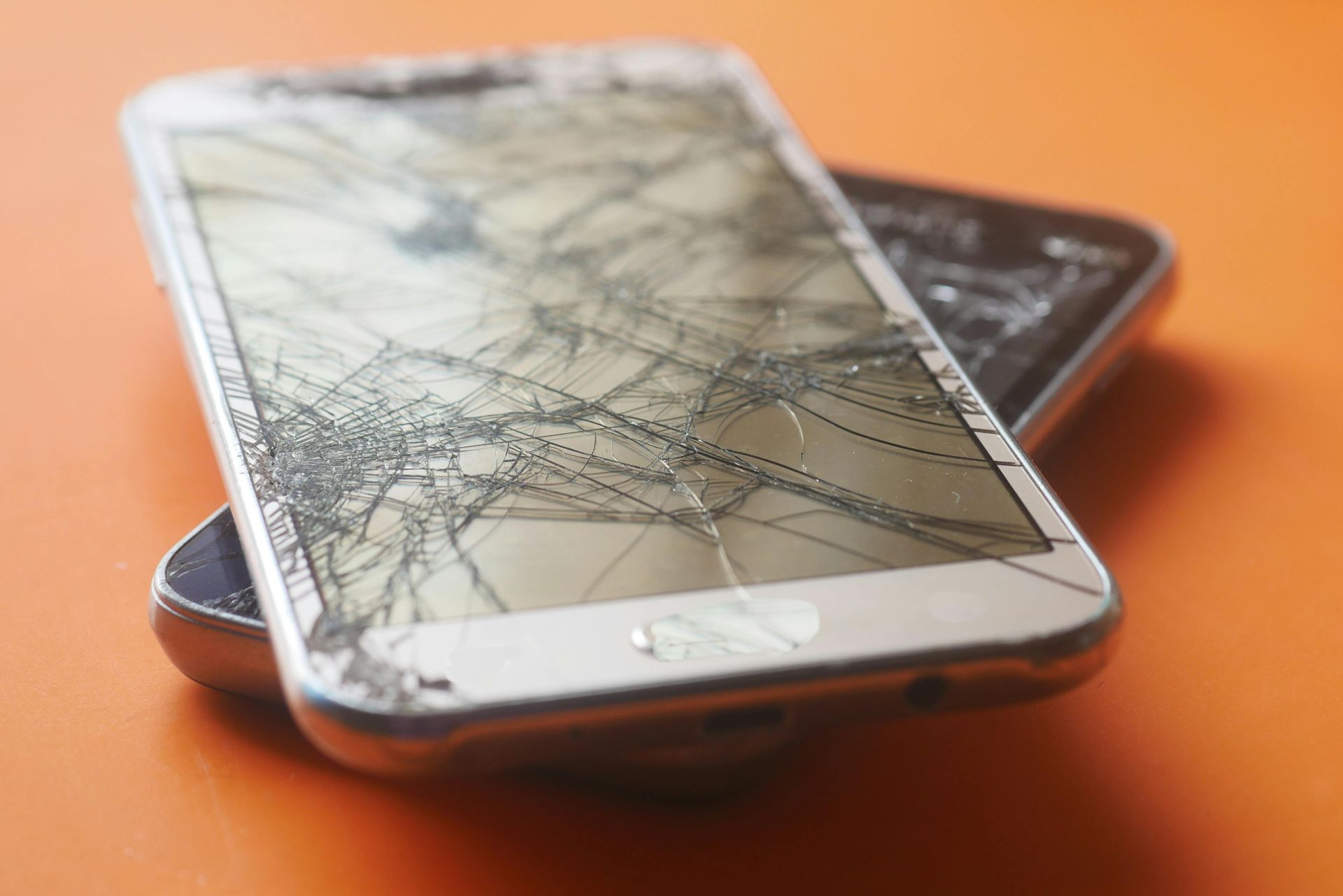A before-and-after comparison showing a broken screen and a fully repaired one