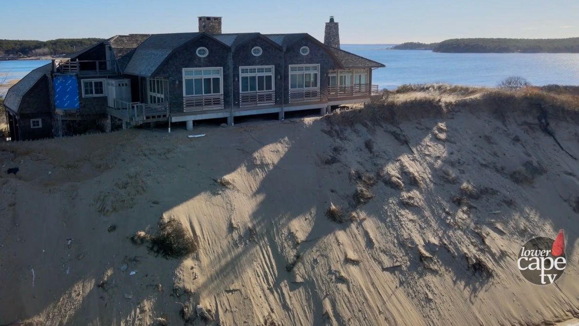 House on eroding cliff in Wellfleet, MA, on Cape Cod.